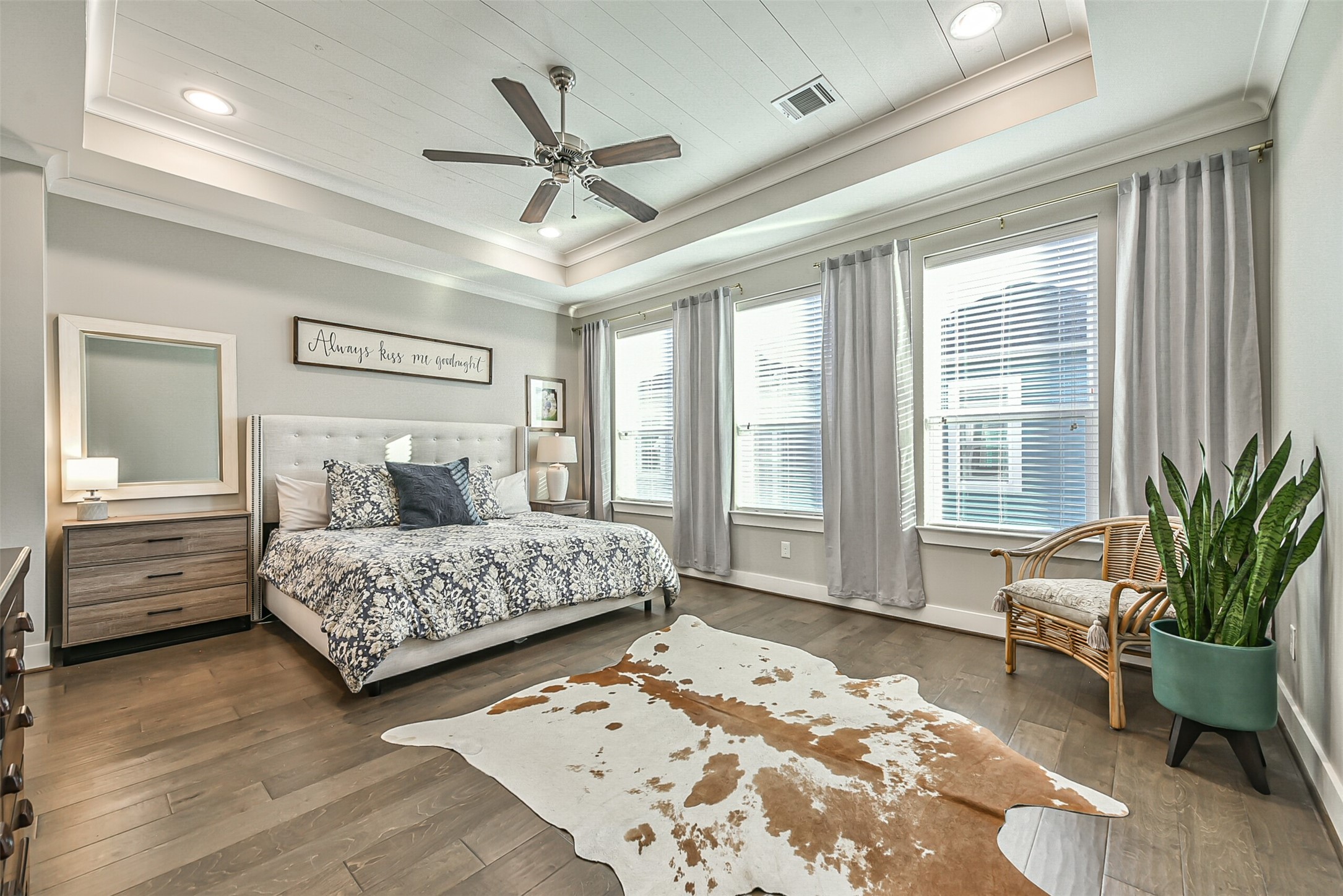 3222 Gillespie Street Houston, TX 77020 - Photo 35 of 43 a bedroom with a large bed and wooden floor