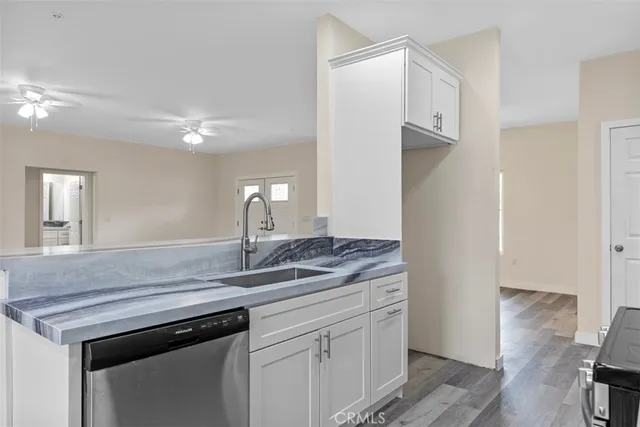 a kitchen with a sink and a refrigerator