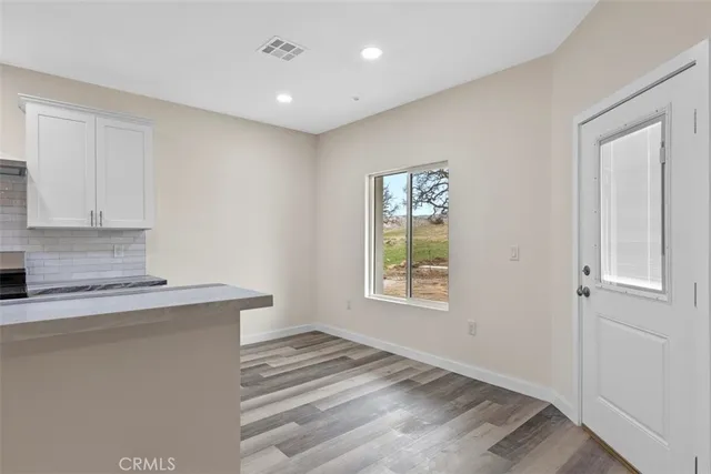 a view of a kitchen with a sink cabinets and a window