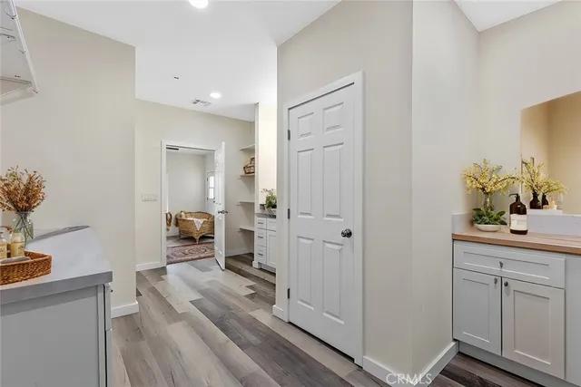 a view of living room with furniture and wooden floor
