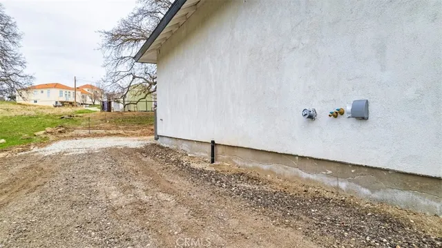 a backyard of a house with a yard and garage