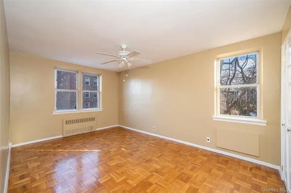 a view of an empty room with windows