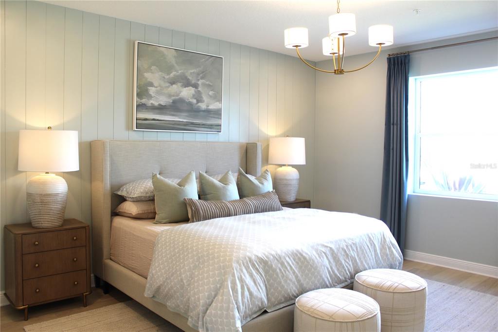 17724 Broadleaf Loop Venice, FL 34293 - Photo 15 of 19 a bedroom with a bed and dresser