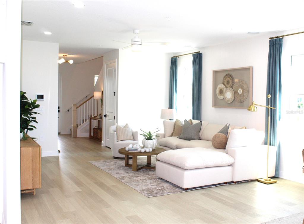 17724 Broadleaf Loop Venice, FL 34293 - Photo 6 of 19 a living room with furniture and wooden floor