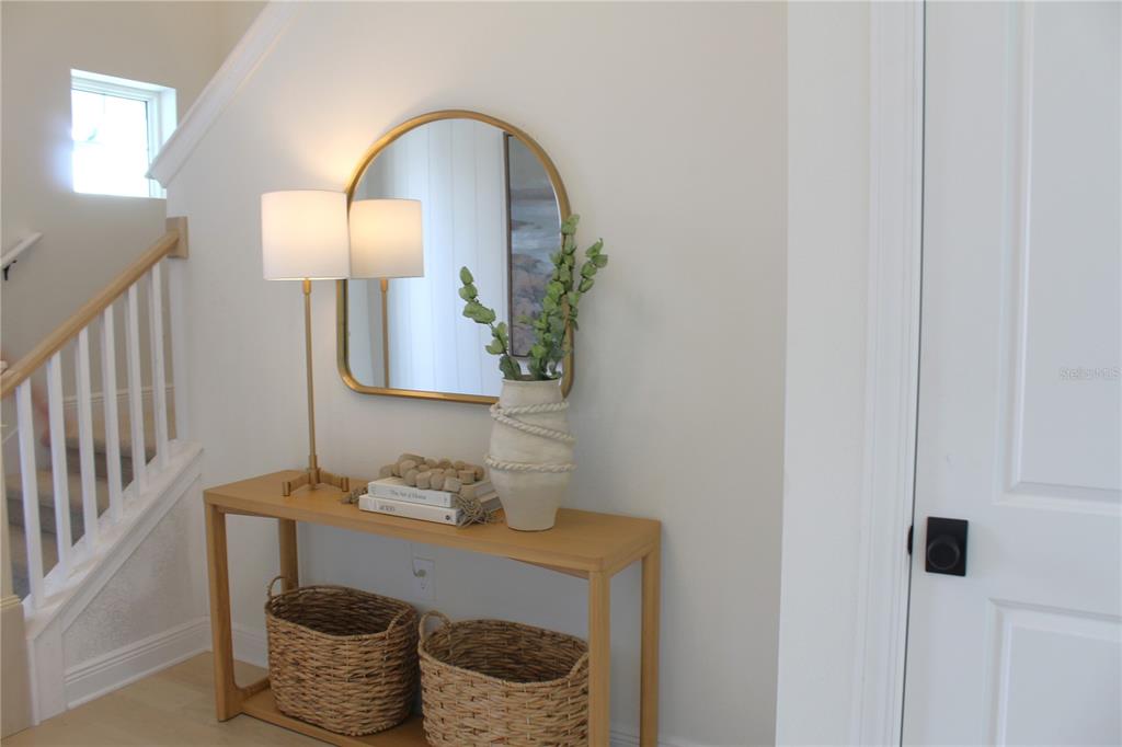 17724 Broadleaf Loop Venice, FL 34293 - Photo 9 of 19 a room with a table and a mirror