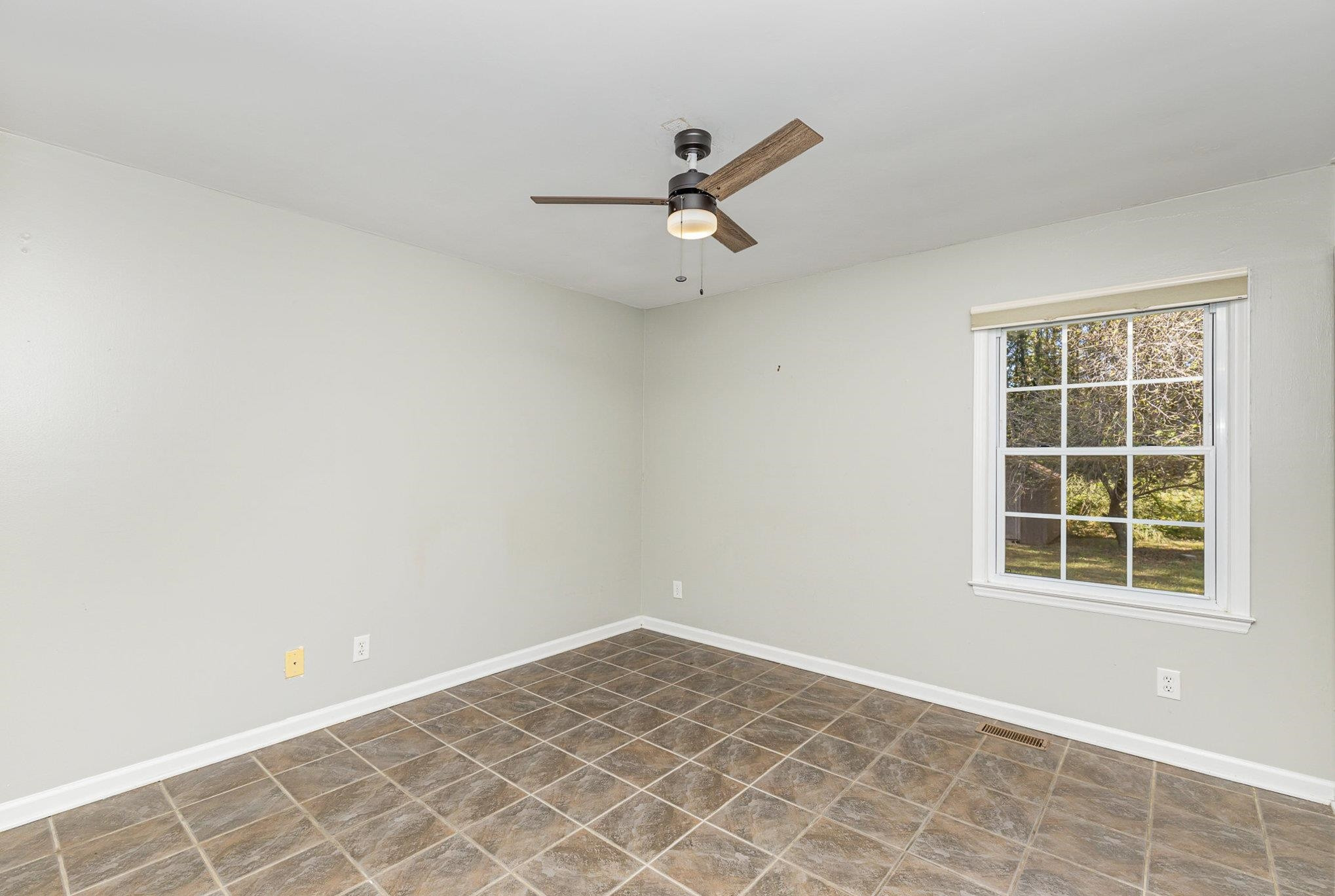 8724 Walter Myatt Road Willow Spring, NC 27592 - Photo 14 of 24 an empty room with a window