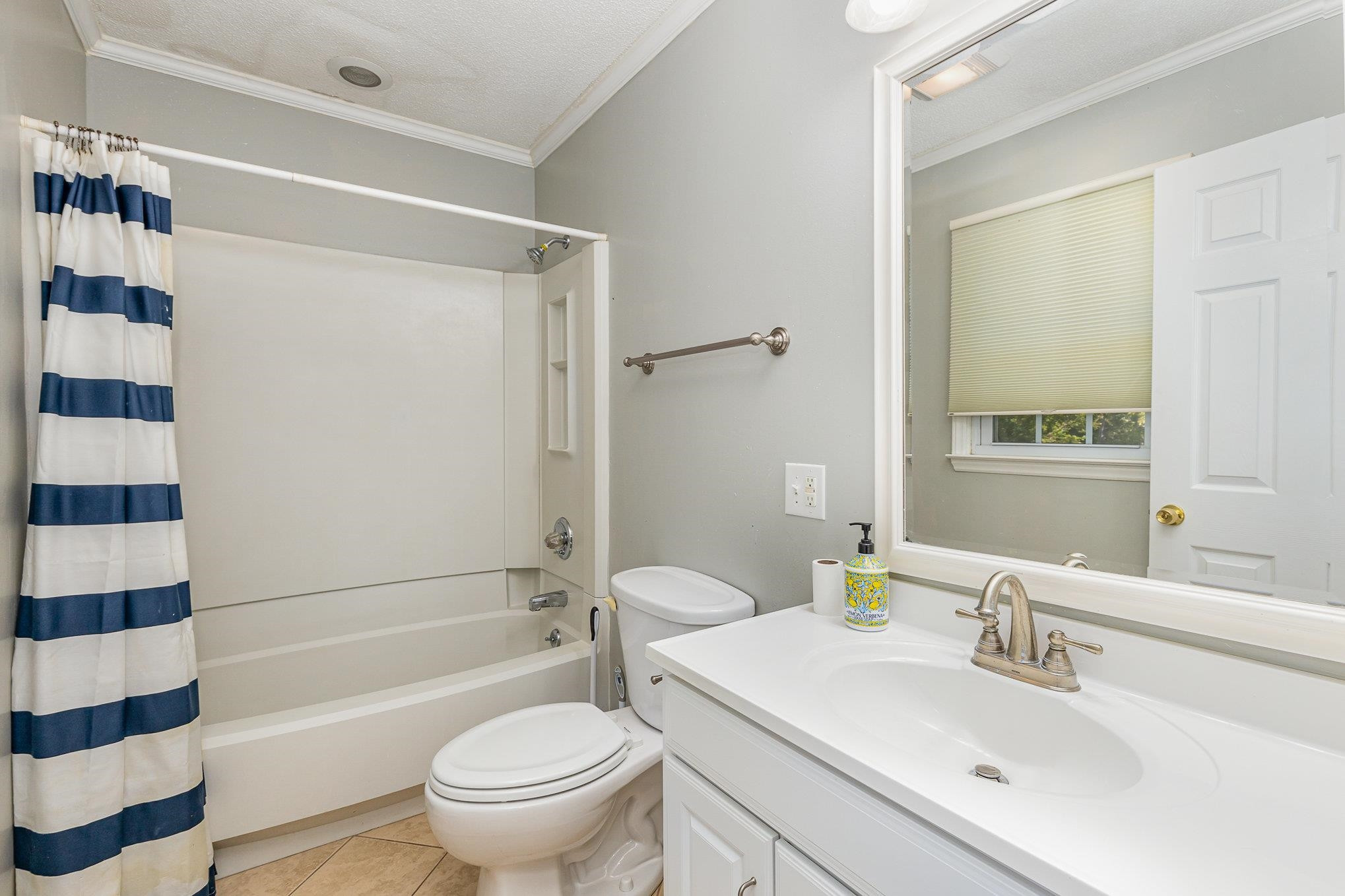 8724 Walter Myatt Road Willow Spring, NC 27592 - Photo 16 of 24 a bathroom with a sink toilet and shower