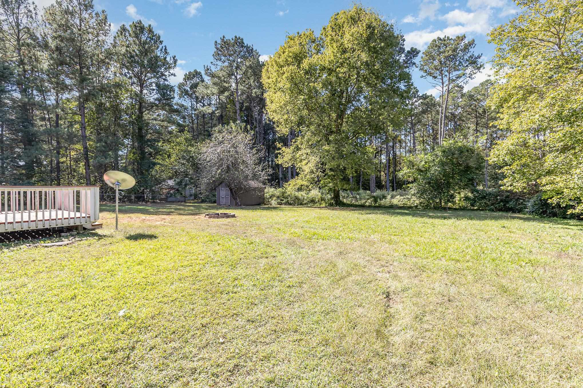 8724 Walter Myatt Road Willow Spring, NC 27592 - Photo 19 of 24 a view of swimming pool with an outdoor seating
