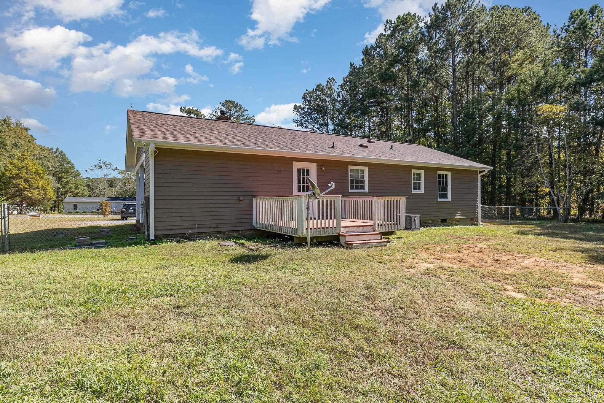 8724 Walter Myatt Road Willow Spring, NC 27592 - Photo 20 of 24 front view of a house with a yard