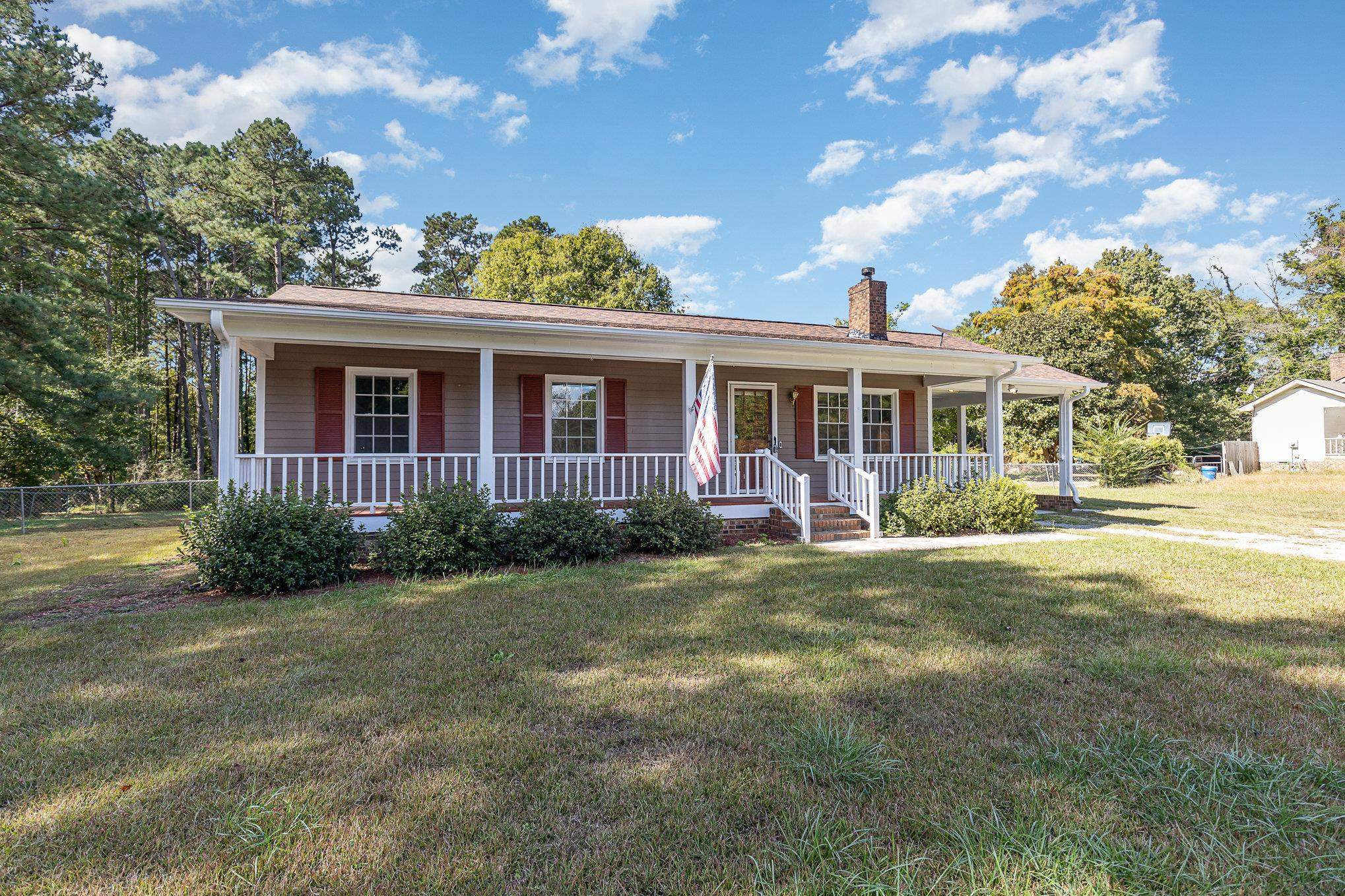 8724 Walter Myatt Road Willow Spring, NC 27592 - Photo 2 of 24 a view of a house with a backyard