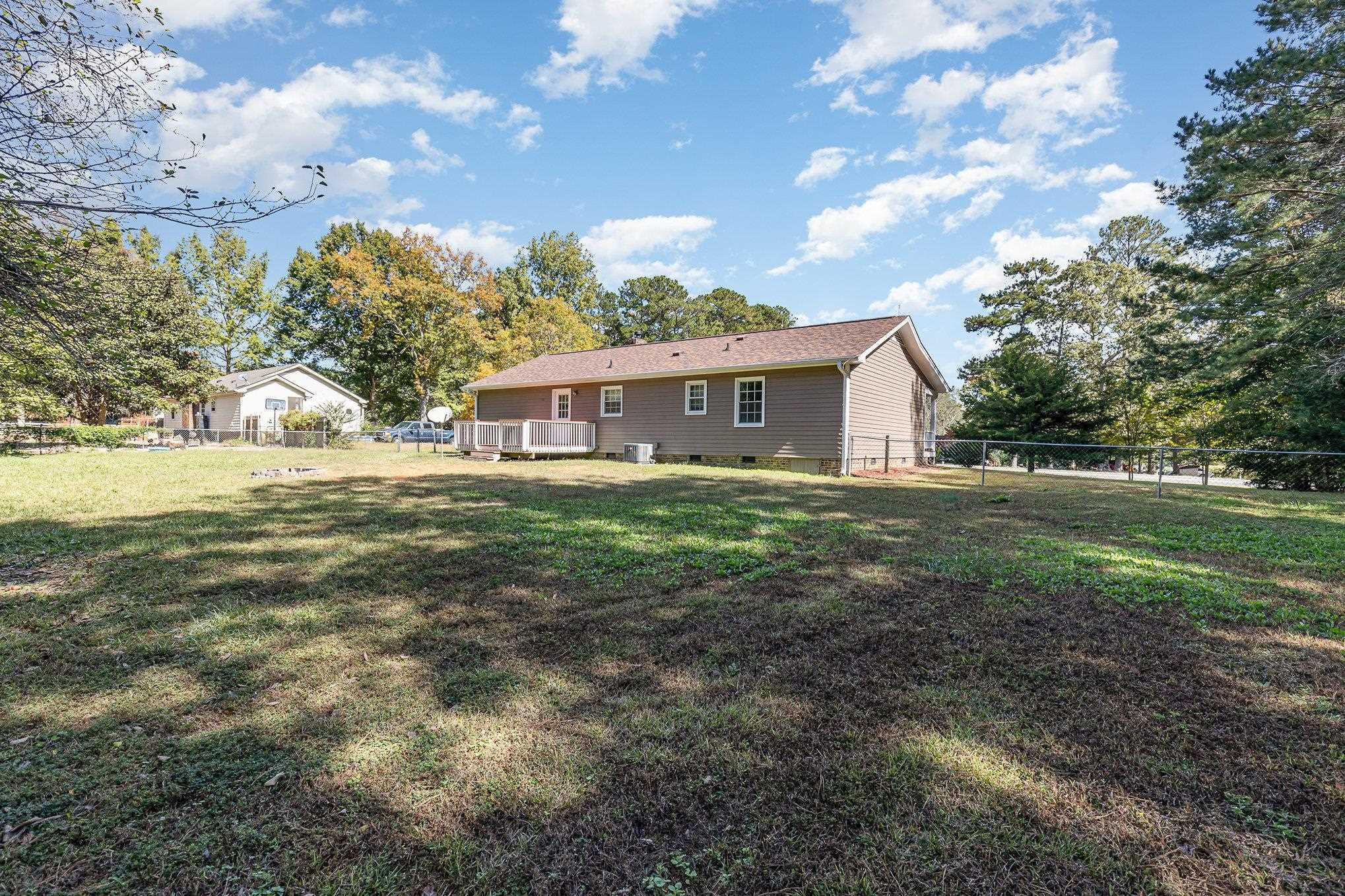 8724 Walter Myatt Road Willow Spring, NC 27592 - Photo 22 of 24 a view of a house with a yard