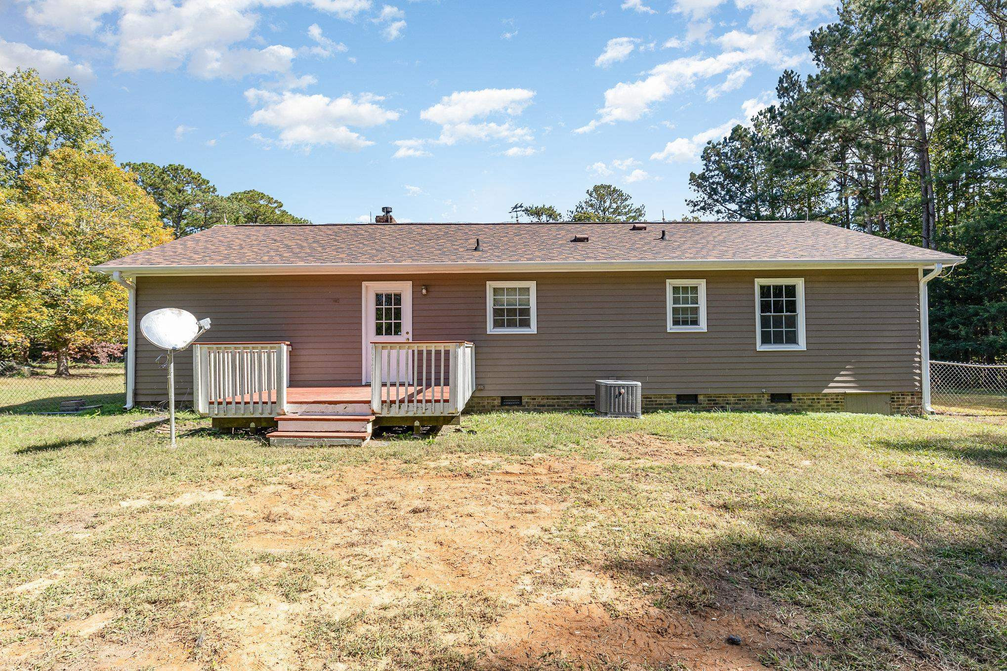 8724 Walter Myatt Road Willow Spring, NC 27592 - Photo 24 of 24 a house with yard in front of it