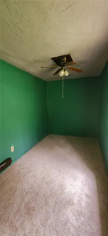 a view of a room with a fan