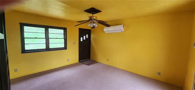 a view of empty room with windows