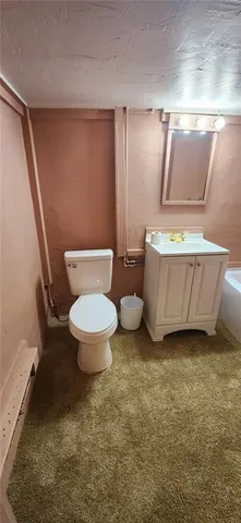 a bathroom with a toilet and a sink