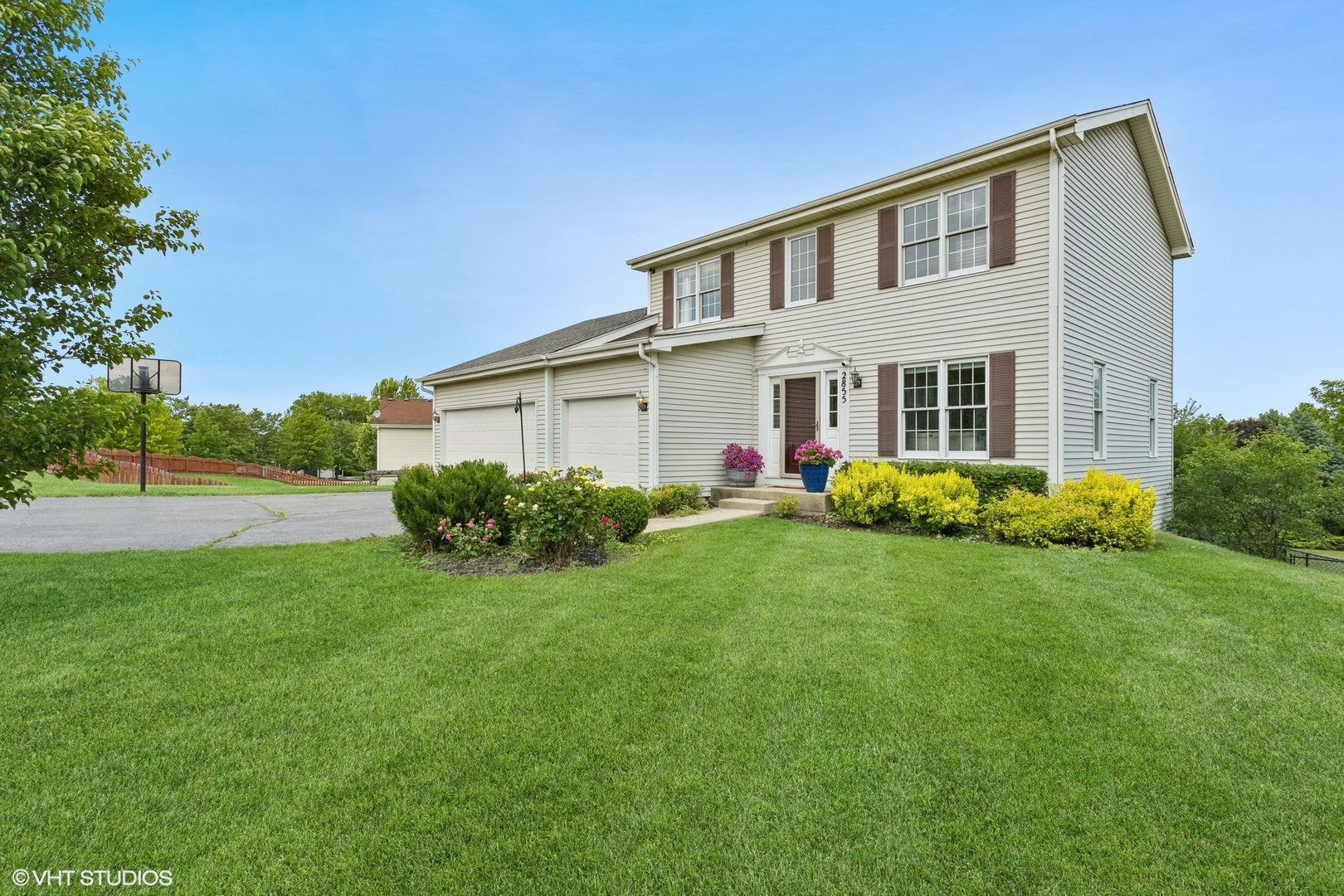 a front view of a house with garden