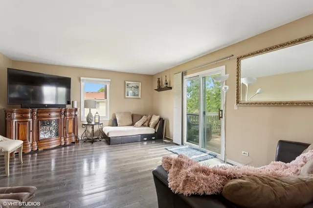 a bedroom with a bed and glass window