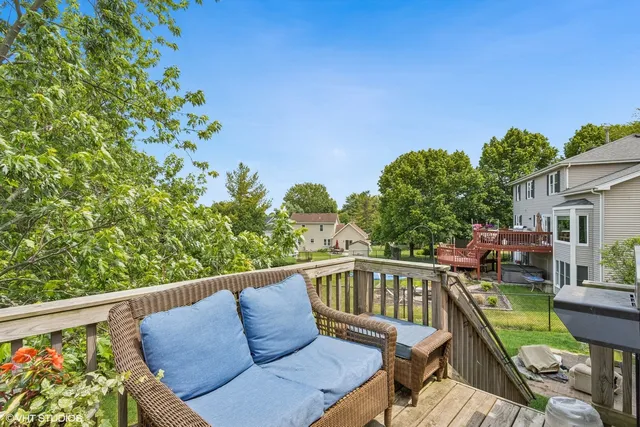 a view of balcony with furniture