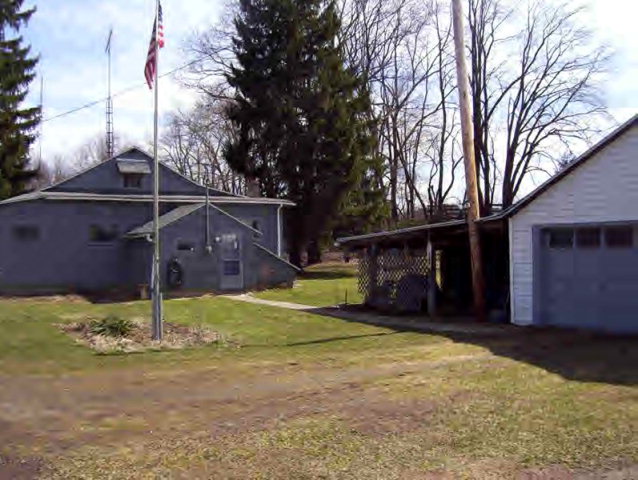12637 Main Street Hydetown, PA 16328 - Photo 1 of 1 a house is sitting in middle of yard