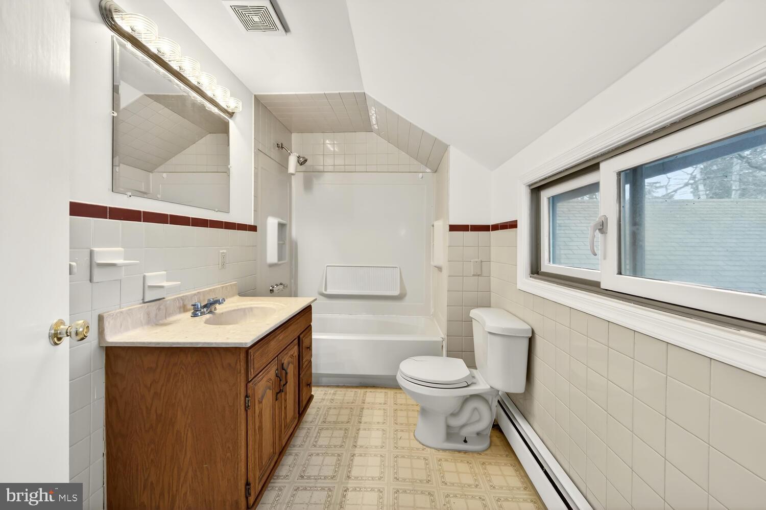 6746 Quaker Neck Road Chestertown, MD 21620 - Photo 46 of 50 a bathroom with a sink toilet and mirror