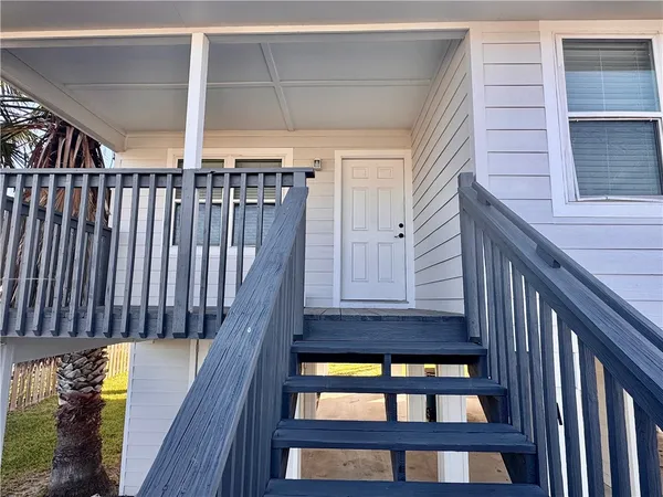 a view of balcony with wooden floor
