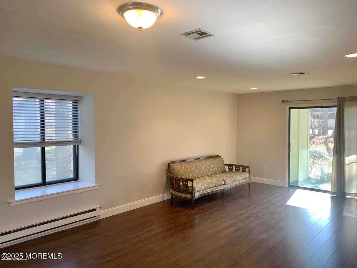 102 Arrowood Road, Unit A Manalapan, NJ 07726 - Photo 4 of 11 a living room with furniture and a window
