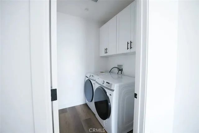 wooden floor in an empty room with stairs