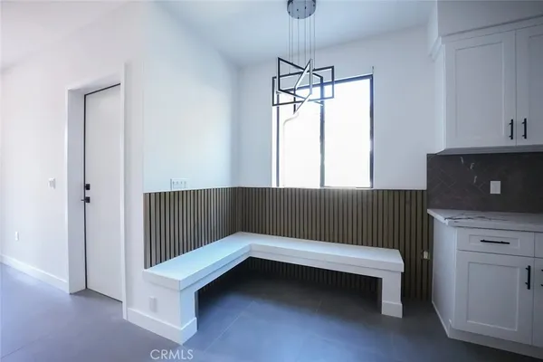 a bathroom with a window and a ceiling fan