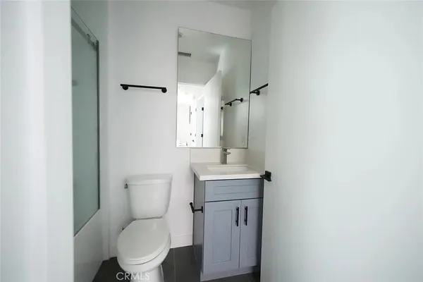 a kitchen with stainless steel appliances a stove a sink and a refrigerator