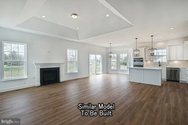 a view of kitchen and windows with white walls