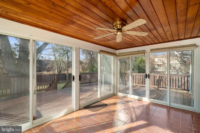 a outdoor space with porch and glass door