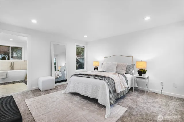 a bedroom with a bed and couch