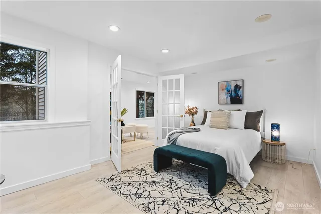 a bedroom with a bed and a window