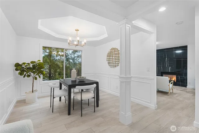 a dining room with furniture and window