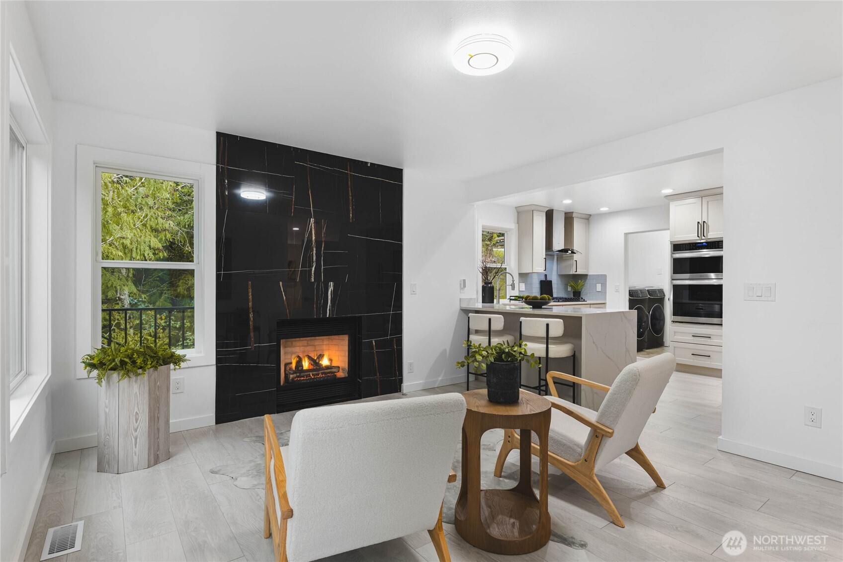 17431 Northeast 28th Street Redmond, WA 98052 - Photo 8 of 32 a living room with furniture and a fireplace
