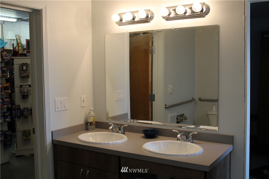 2882 East Badger Road Everson, WA 98247 - Photo 29 of 40 a bathroom with a sink and a mirror