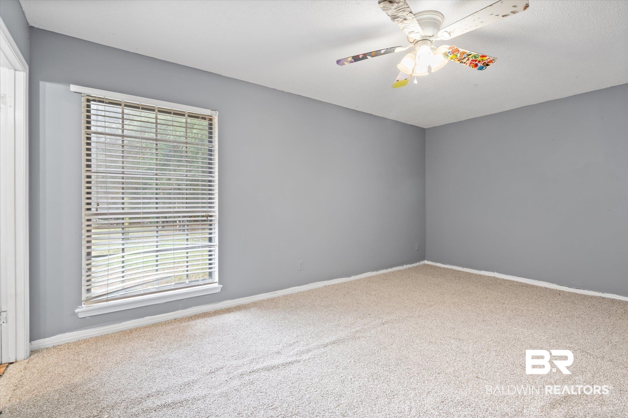 9445 Howells Ferry Road Semmes, AL 36575 - Photo 11 of 20 Unfurnished room featuring ceiling fan and carpet