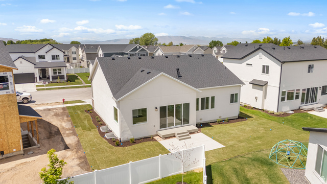 43 South Crimson Way, Unit 311 Mapleton, UT 84664 - Photo 26 of 28 White exterior with dark shingle roofing