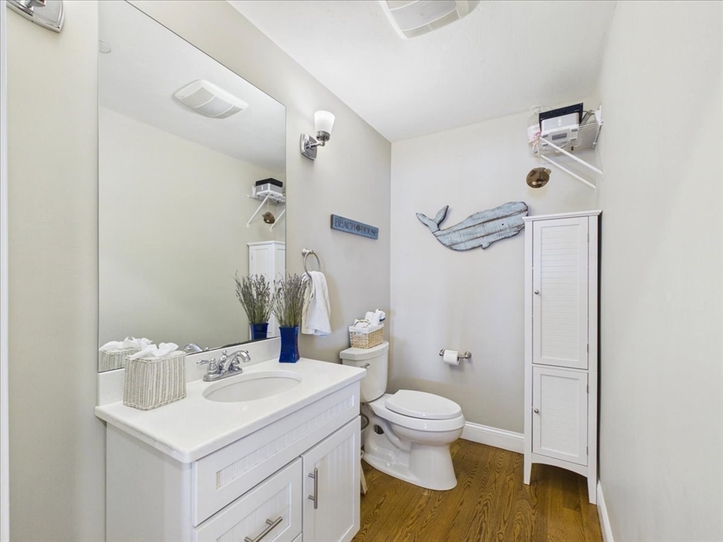 7 Bay Street, Unit 3 Hull, MA 02045 - Photo 33 of 40 a bathroom with a sink toilet and shower