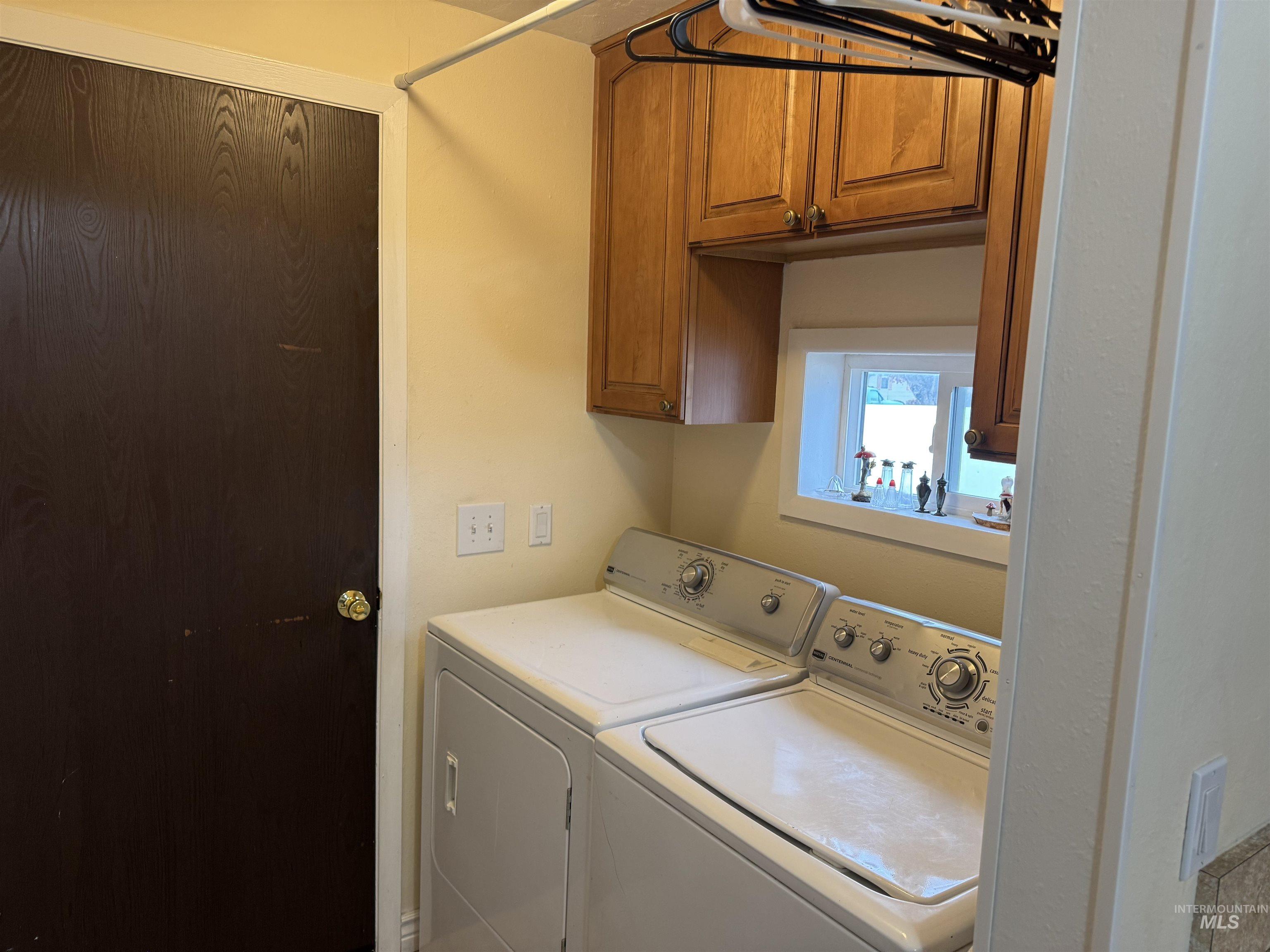 1145 Utah Street Gooding, ID 83330 - Photo 14 of 50 Laundry area with washer and dryer and cabinet space