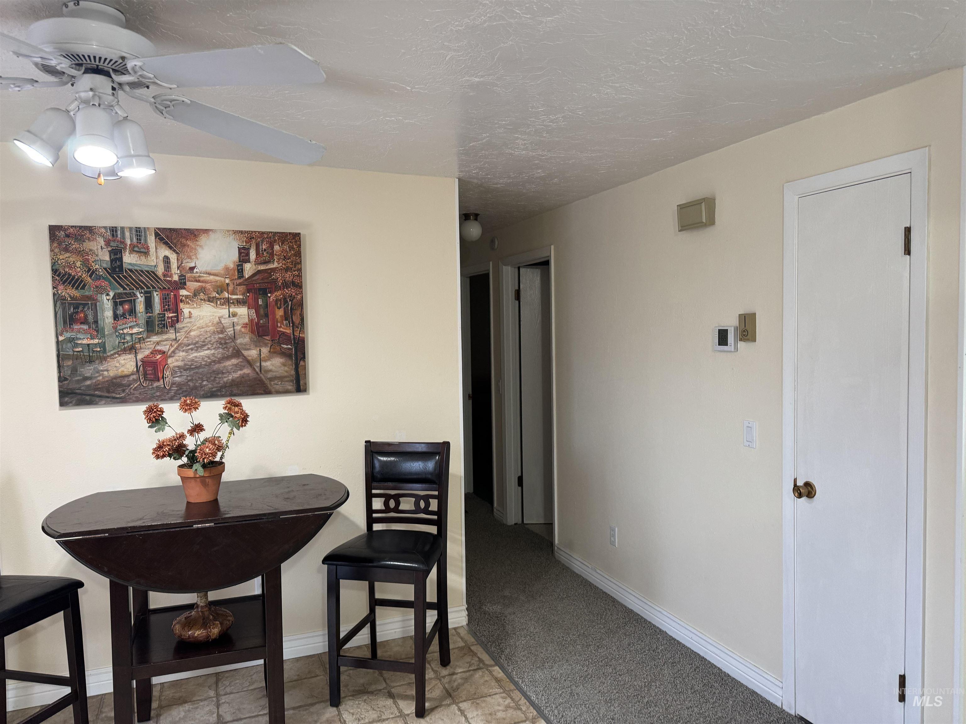 1145 Utah Street Gooding, ID 83330 - Photo 17 of 50 Dining area with ceiling fan and light colored carpet