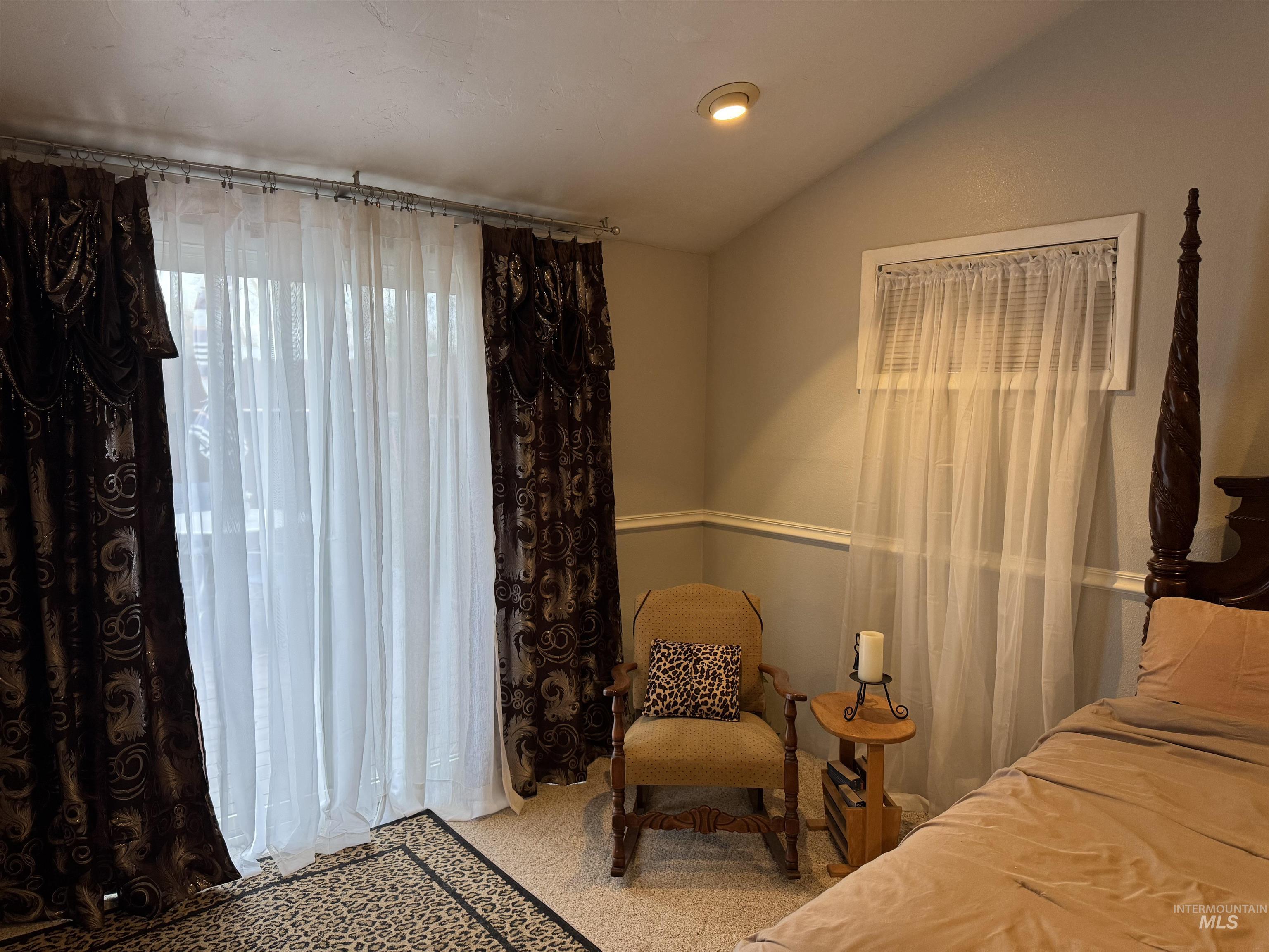 1145 Utah Street Gooding, ID 83330 - Photo 32 of 50 Bedroom featuring vaulted ceiling, light colored carpet, and recessed lighting