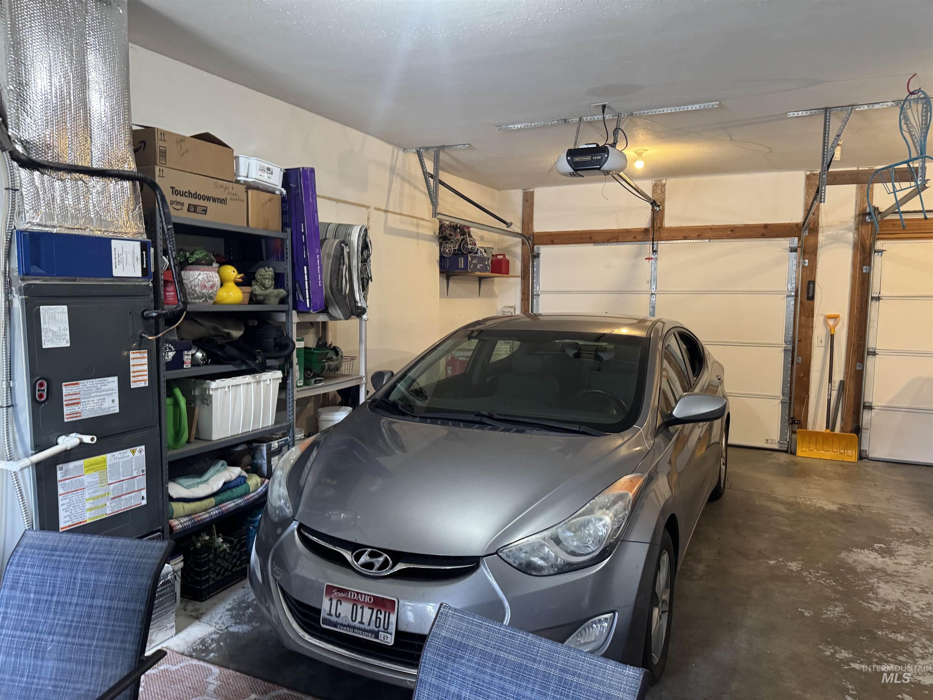 1145 Utah Street Gooding, ID 83330 - Photo 34 of 50 Garage featuring heating unit and a garage door opener