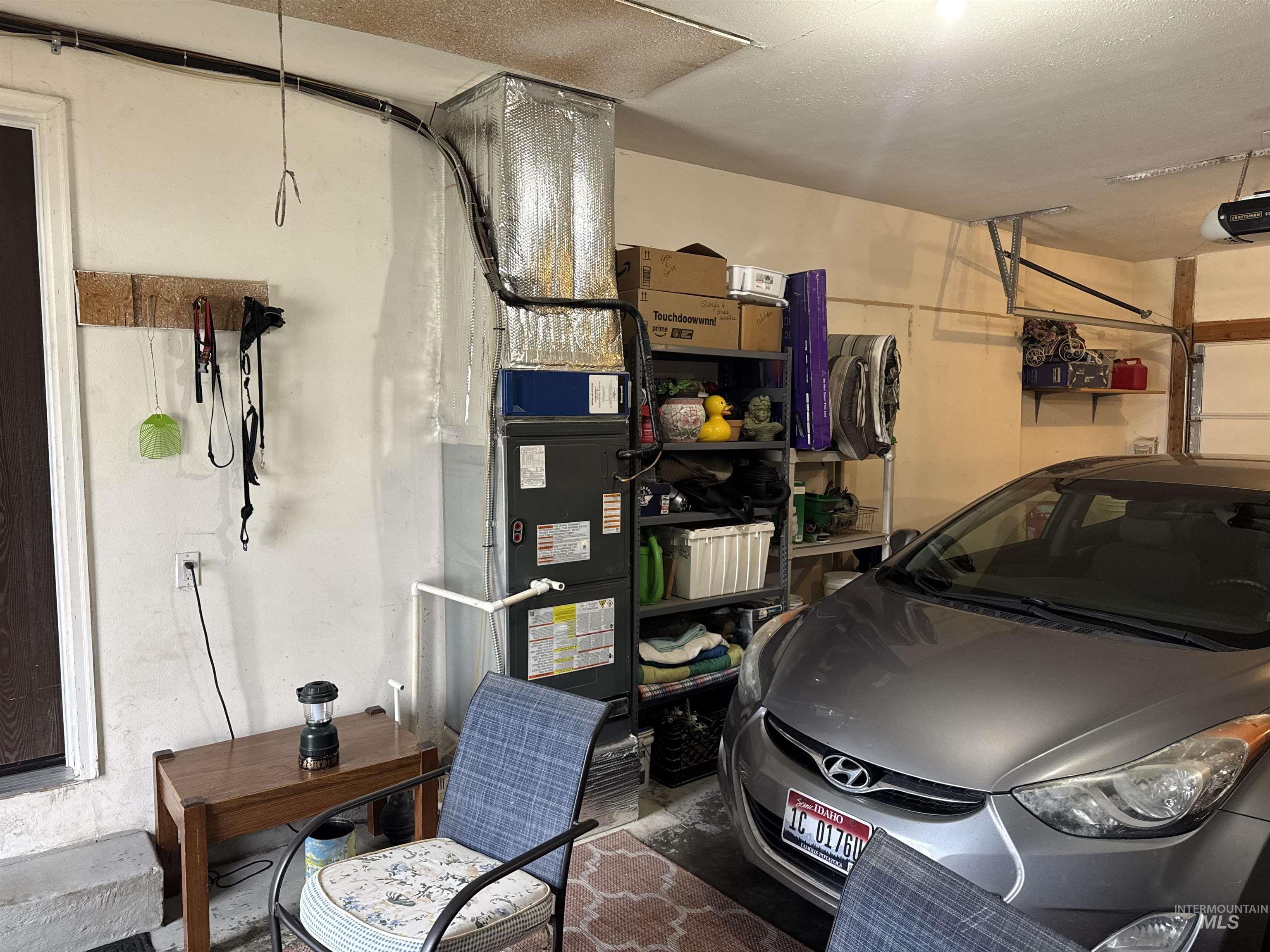 1145 Utah Street Gooding, ID 83330 - Photo 38 of 50 Garage featuring heating unit and a garage door opener