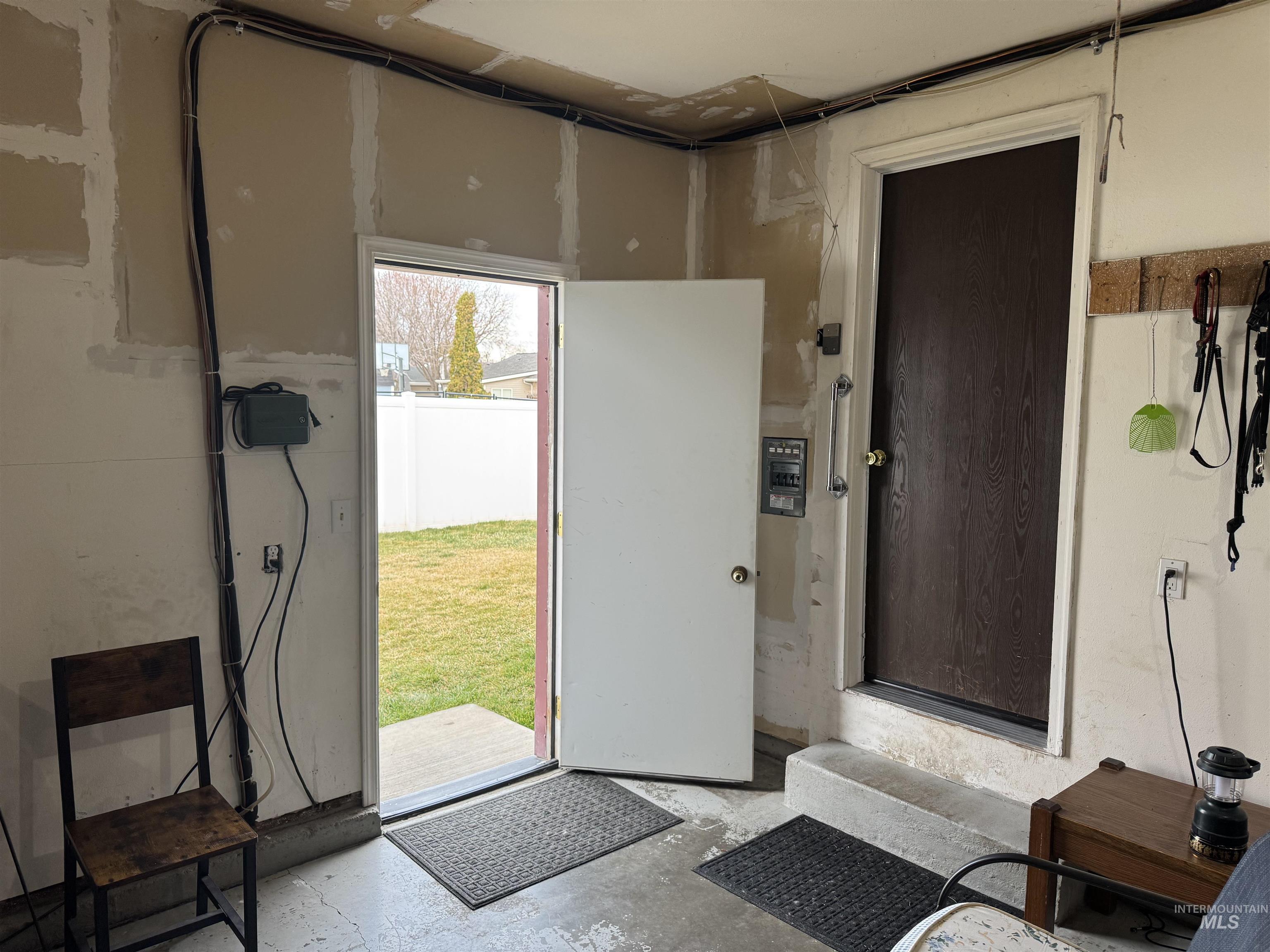 1145 Utah Street Gooding, ID 83330 - Photo 39 of 50 Doorway to outside featuring unfinished concrete floors
