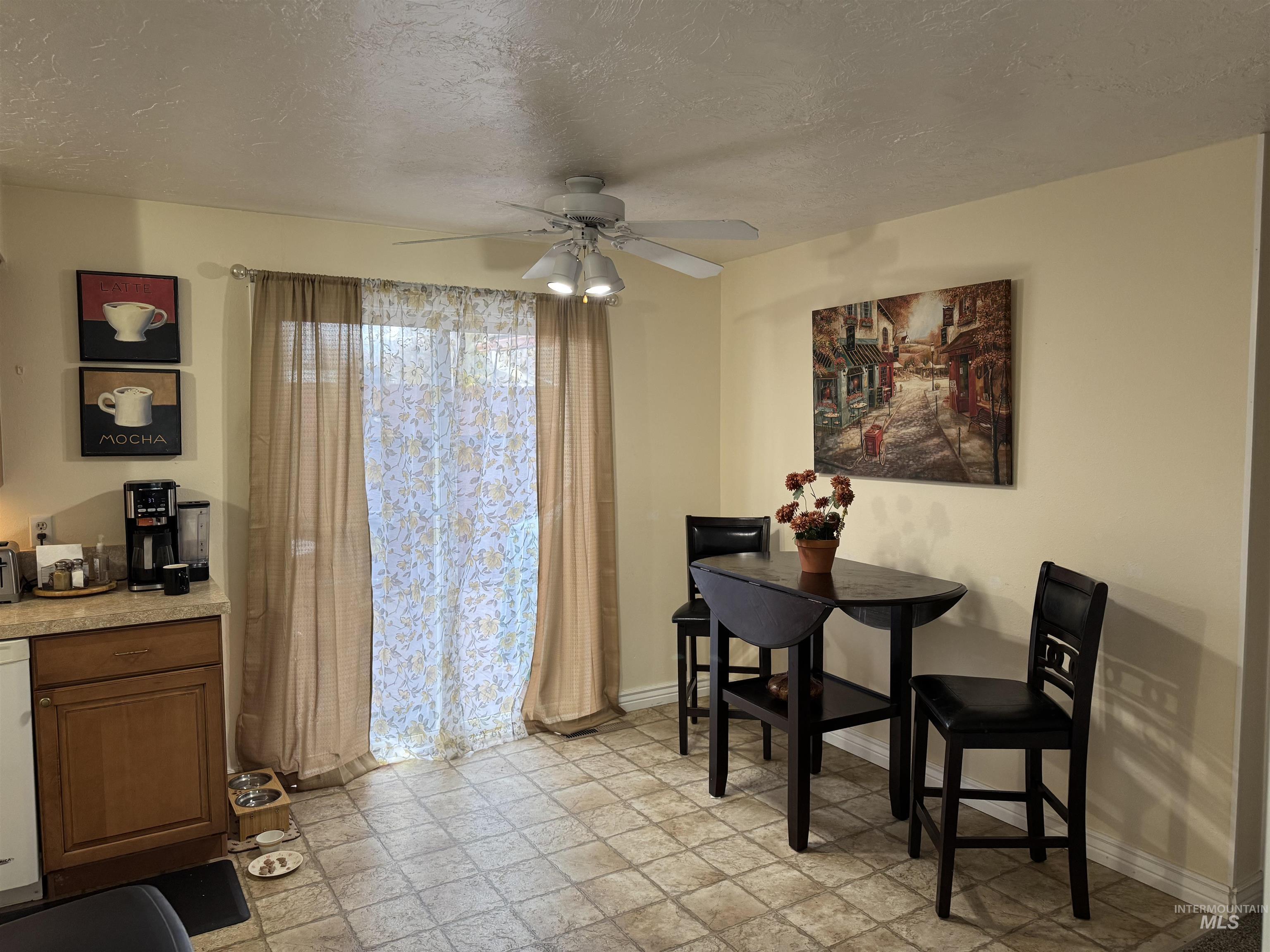 1145 Utah Street Gooding, ID 83330 - Photo 9 of 50 Dining area with a textured ceiling and a ceiling fan