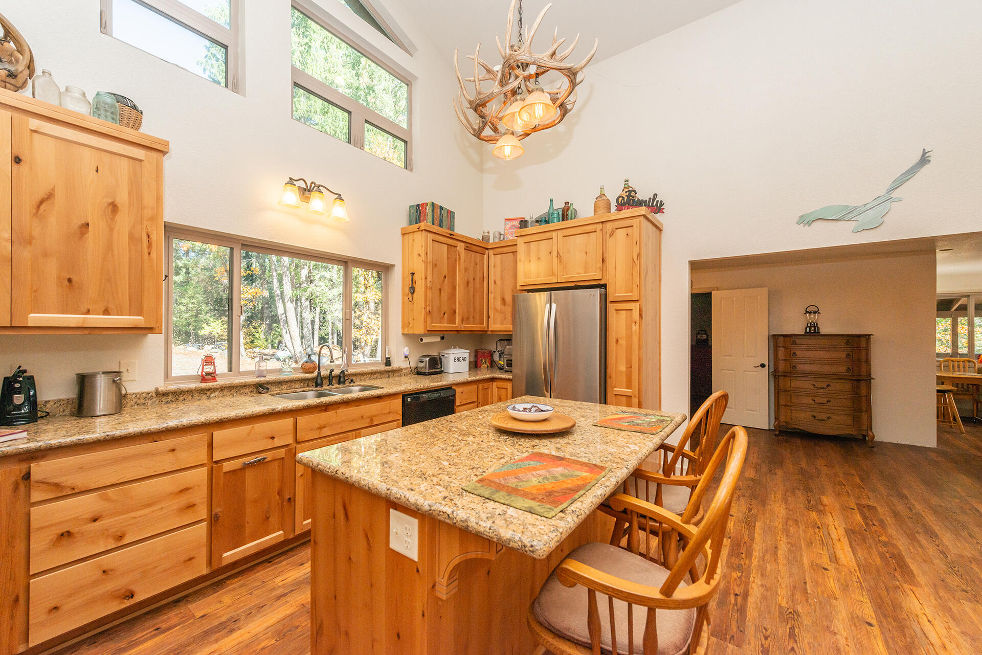 851 Mountain Aire Road Trinity Center, CA 96091 - Photo 22 of 54 a kitchen with a sink appliances and cabinets