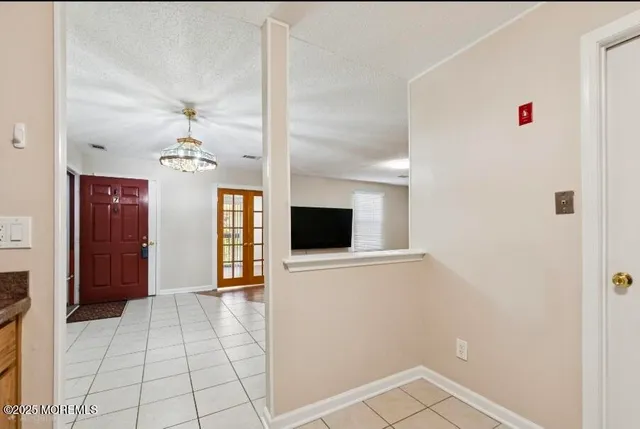a view of a livingroom with an empty space and a fireplace