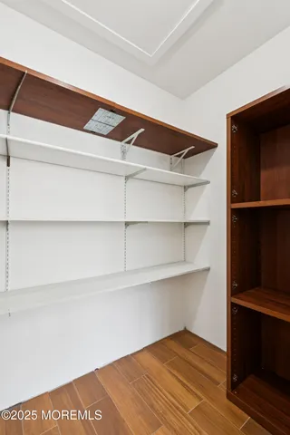 a view of an empty walk in closet