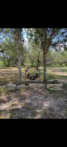 a view of a yard with an outdoor space